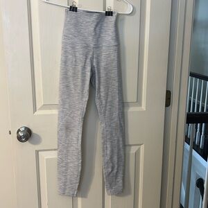 These are grey and white lululemon leggings. They have never been worn.
